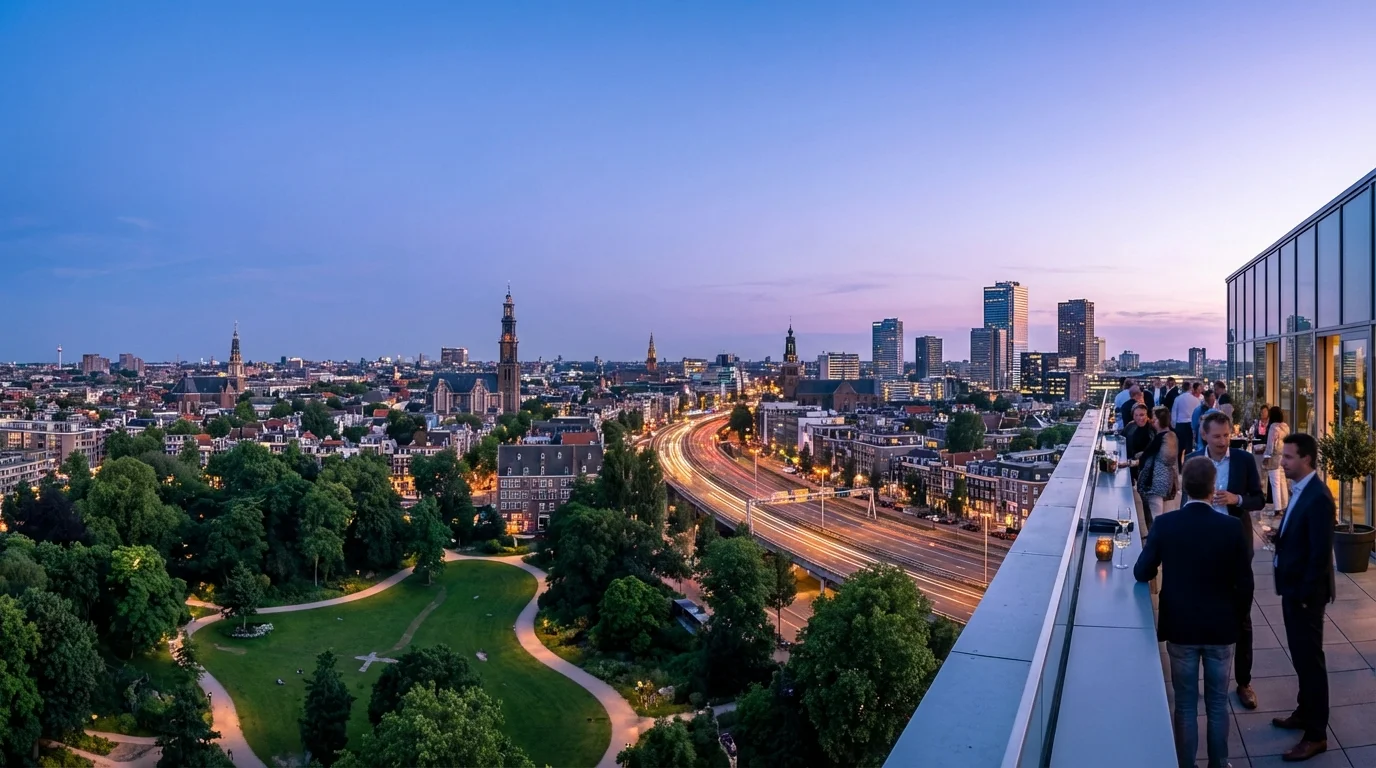 Panoramic Amsterdam skyline at blue hour viewed from a rooftop terrace overlooking Rembrandtpark